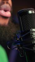 Vertical Skilled artist composing a new song with his lyrics and piano tunes, recording audio files to edit them with mixing and mastering techniques. Young talented musician produces music. Camera A. video