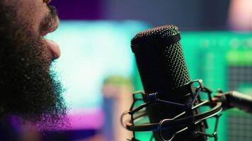 Skilled composer producing a new melody with lyrics and piano keys, recording audio files to edit them with mixing console. Young talented artist producer creating soundtracks. Camera A. video