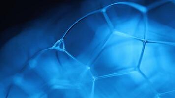 Blue water bubbles pattern, fluid background, plasma, fluid movement, dark gloomy background, smooth moving, fantastic water forms video