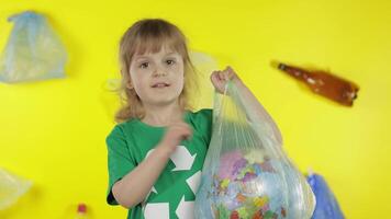 Girl activist with Earth globe in plastic package. Reduce trash pollution. Save ecology environment video