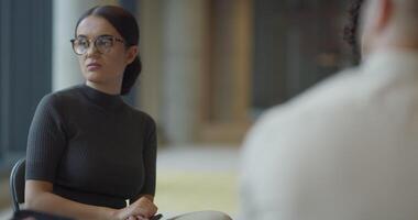 A diverse group of entrepreneurs engages in a dynamic business meeting within a modern office, showcasing their collaborative spirit and innovative approach to business development video