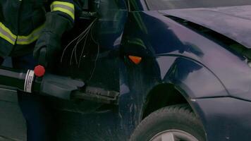 A skilled team of firefighters employs specialized tools and quick reactions to successfully extricate a person trapped in a car, showcasing their heroism and precision in a high-stakes rescue video