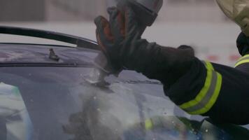 A skilled team of firefighters employs specialized tools and quick reactions to successfully extricate a person trapped in a car, showcasing their heroism and precision in a high-stakes rescue video