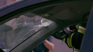 A skilled team of firefighters employs specialized tools and quick reactions to successfully extricate a person trapped in a car, showcasing their heroism and precision in a high-stakes rescue video