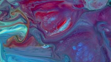 Abstract slow motion ink background Super vibrant colorful paint cosmic swirls and wave flowing forms. video