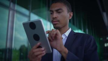 A Business Professional Actively Using a Tablet in a Contemporary Office Environment Setting video