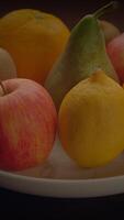 A Beautifully Arranged Colorful Assortment of Various Fresh Fruits Displayed on a Plate video