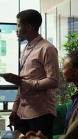 Vertical Employee and general manager getting into an argument during a briefing meeting with the executive board members and shareholders. Associates fighting in front of all the coworkers. Camera B. video