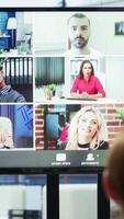 Vertical Diverse team of workers reviewing project updates together with shareholders on call online meeting, ensuring easy remote collaboration for global business expansion plans. Teamwork. Camera A. video