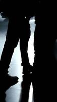 Silhouettes cast upon a gleaming and reflective surface create an intriguing visual experience video