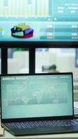 Vertical Empty modern office setup with advanced technology enhances productivity, helping professionals focus on financial strategies, performance metrics and global business objectives. video