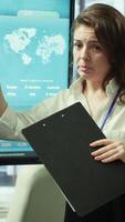 Vertical Business associates reviewing key performance indicators within the enterprise activity. Conducting evaluations and discuss training to foster development, enhance team efficiency. Camera A. video