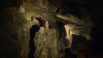 Illuminated Dark Rocky Stone Dripstone Caves Stalactite Background video