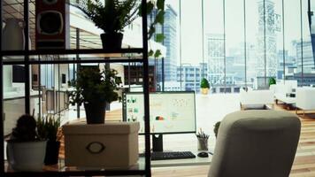 High end company office with a computer showing detailed data insights, executive business meetings or financial planning in a boardroom. Project development in a modern workspace. video