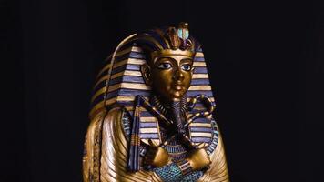 Egyptian King Tutankhamun Statue Figurine Rotating on Turntable Historic Display video