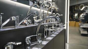 Exhibition showcase in store with faucets for the kitchen and bathroom video