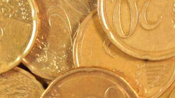 Scattered 20 Euro Cent Coins, Rotating Money Background - Top View, Macro. Euro Money Currency. A Lot of Twenty Cent Cash. Business, Finances and Money Saving Concept - Rotation Right video