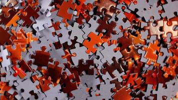 Background of Colored Puzzle Pieces that Rotating Clockwise - Top View. Texture of Incomplete Red and Grey Jigsaw Puzzle - Right Rotation video