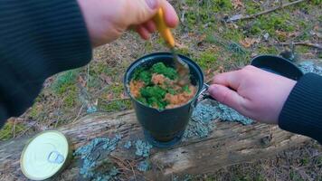Camp Food. Cooking in a Hike Using a Small Cook Set - First Person View, Wide Angle. Food on the Trip. Traveler in a Spring Forest. Tourist in a Travel is Heating Food - POV Shot. video