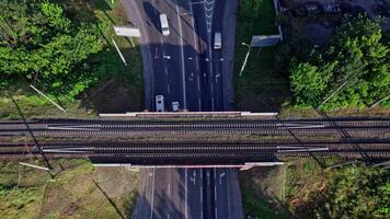 Aerial view of empty double-track railway line leading through town video