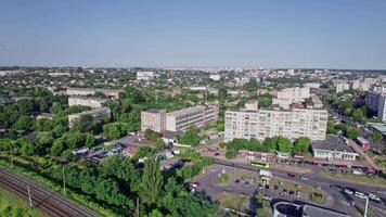 Aerial view of empty double-track railway line leading through town video
