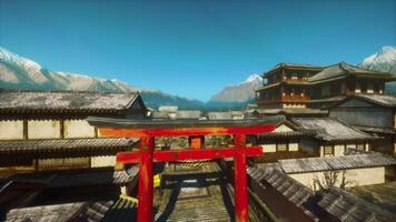 Exploring traditional Japanese architecture against a backdrop of mountains video