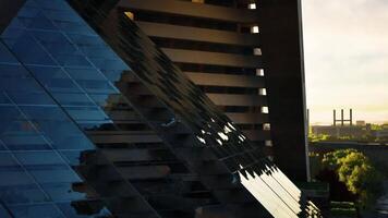Reflections of modern architecture at sunset in an urban setting video