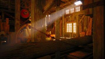 Sunlight beams through windows in an old wooden workshop with machinery video