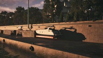 Boat docked at the marina with afternoon sunlight casting long shadows video