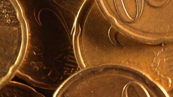 Scattered 20 Euro Cent Coins, Rotating Money Background - Top View, Macro. Euro Money Currency. A Lot of Twenty Cent Cash. Business, Finances and Money Saving Concept - Slow Rotation Right video