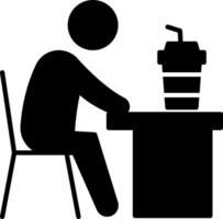 A person sitting at a desk with a drink vector