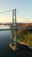 Aerial view of Lions Gate Bridge and Stanley Park at dawn. Canada video
