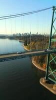Aerial view of Lions Gate Bridge and Stanley Park at dawn. Canada video