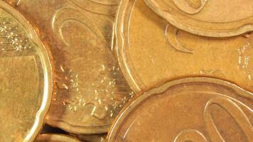 Scattered 20 Euro Cent Coins, Rotating Money Background - Top View, Macro. Euro Money Currency. A Lot of Twenty Cent Cash. Business, Finances and Money Saving Concept - Slow Rotation Right video
