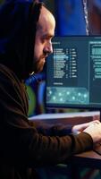 Vertical Hacker in hidden base excited after successfully getting past anti tamper measures implemented by companies to protect their products. Joyous cracker celebrating after managing to pirate software video