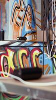 Vertical Empty pizza boxes and spray cans left over in dirty ghetto by urban explorers venturing into abandoned structures. Graffiti art and scattered debris done by guerilla artists in urbex location video