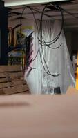 Vertical Empty building with destroyed items and graffiti paint, concept of subversive lifestyle. Criminal hideout used by teenagers to hangout and commit illegal drawing on walls video