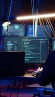 Vertical Hacker leaving secret base with SSD in briefcase containing data obtained from victim after tricking it into installing ransomware program. Man exiting base of operations with suitcase, camera B video