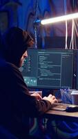Vertical Hacker uses PC to target vulnerable unpatched connections, seeking to compromise digital devices and steal valuable sensitive data. Rogue programmer finds exploits for system vulnerabilities, camera B video
