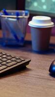Vertical Meticulous hacker typing on computer keyboard, doing data breaches and financial theft in dark bunker. Close up shot on cybercriminal stealing users bank account credentials, camera B video