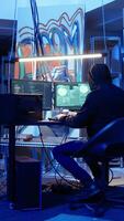 Vertical Hacker leaving secret base with SSD in briefcase containing data obtained from victim after tricking it into installing ransomware program. Man exiting base of operations with suitcase, camera A video