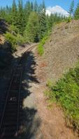FPV drone is flying fast forward over railway track. Canada video