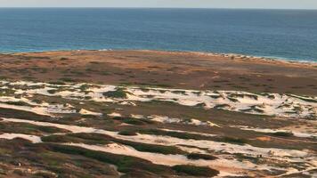 Aerial view around the western tip of the Caribbean island of Aruba video