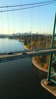 Aerial view of Lions Gate Bridge and Stanley Park at dawn. Canada video