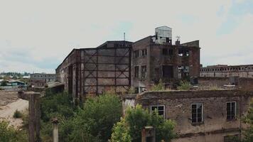 Aerial view from the air to an abandoned factory. Old industrial building for demolition. video
