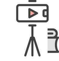 camera on tripod with a laptop and a book vector
