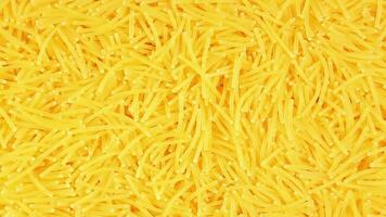 Background of Uncooked Noodles that Slowly Rotating Counter-Clockwise - Top View, Angular Rotation. Texture of Dry Vermicelli Turning Around. Raw Pasta - Left Rotation video