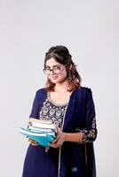 Classy Lady in Salwar Kameez Suit Holding Books in Hands photo