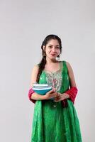 Front View of College Excellent Student Holding Books in Hand photo