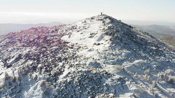 View from the drone to the top with her people and the slope of Mount Golets video
